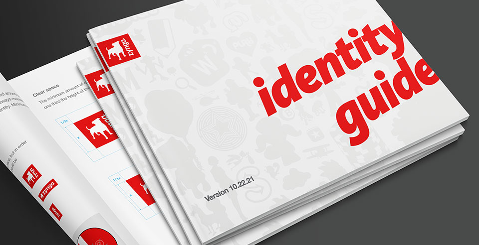 A small stack of Zynga's brand identity style guides.