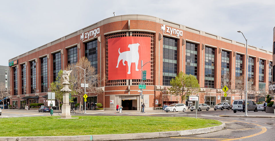 Zynga headquarters showing the brand's signage with the new logo on two extruded signs and one three-story banner, corner wrap on the building. 