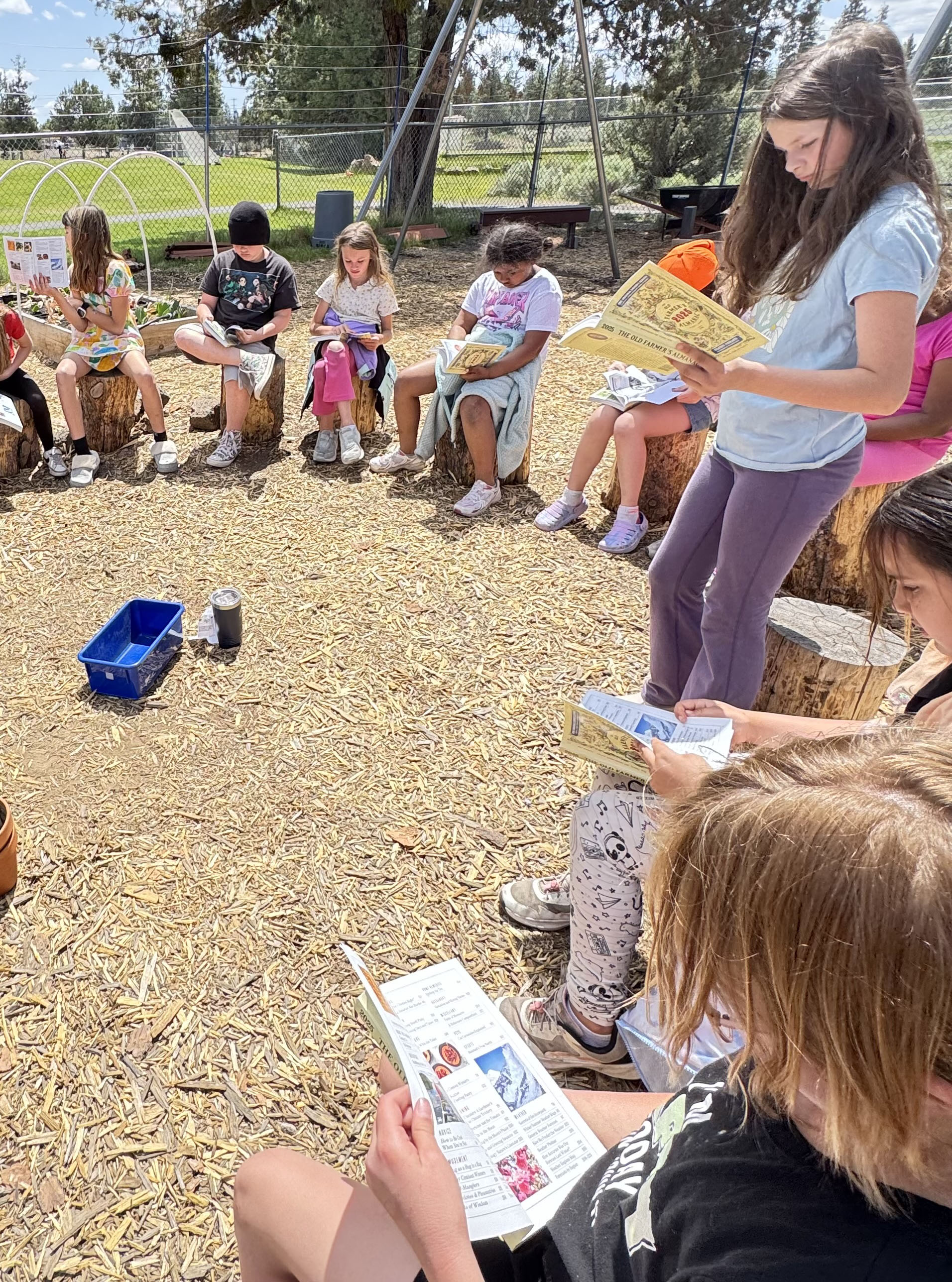 An image showing kids in a reading circle
