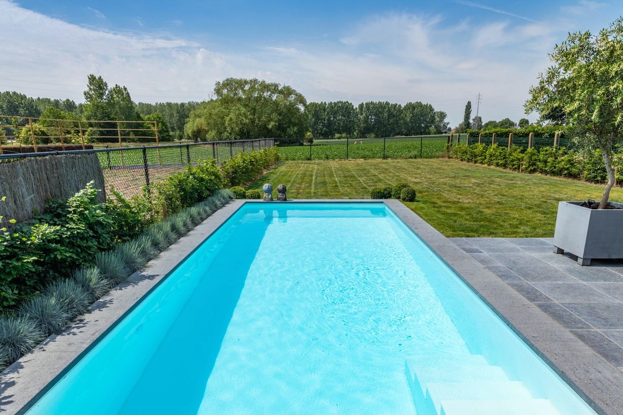 One-piece skimmer pool in a garden, Aqualuxe