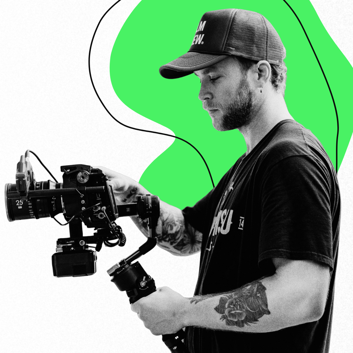 A man holding a camera to record videos in front of a white and green background