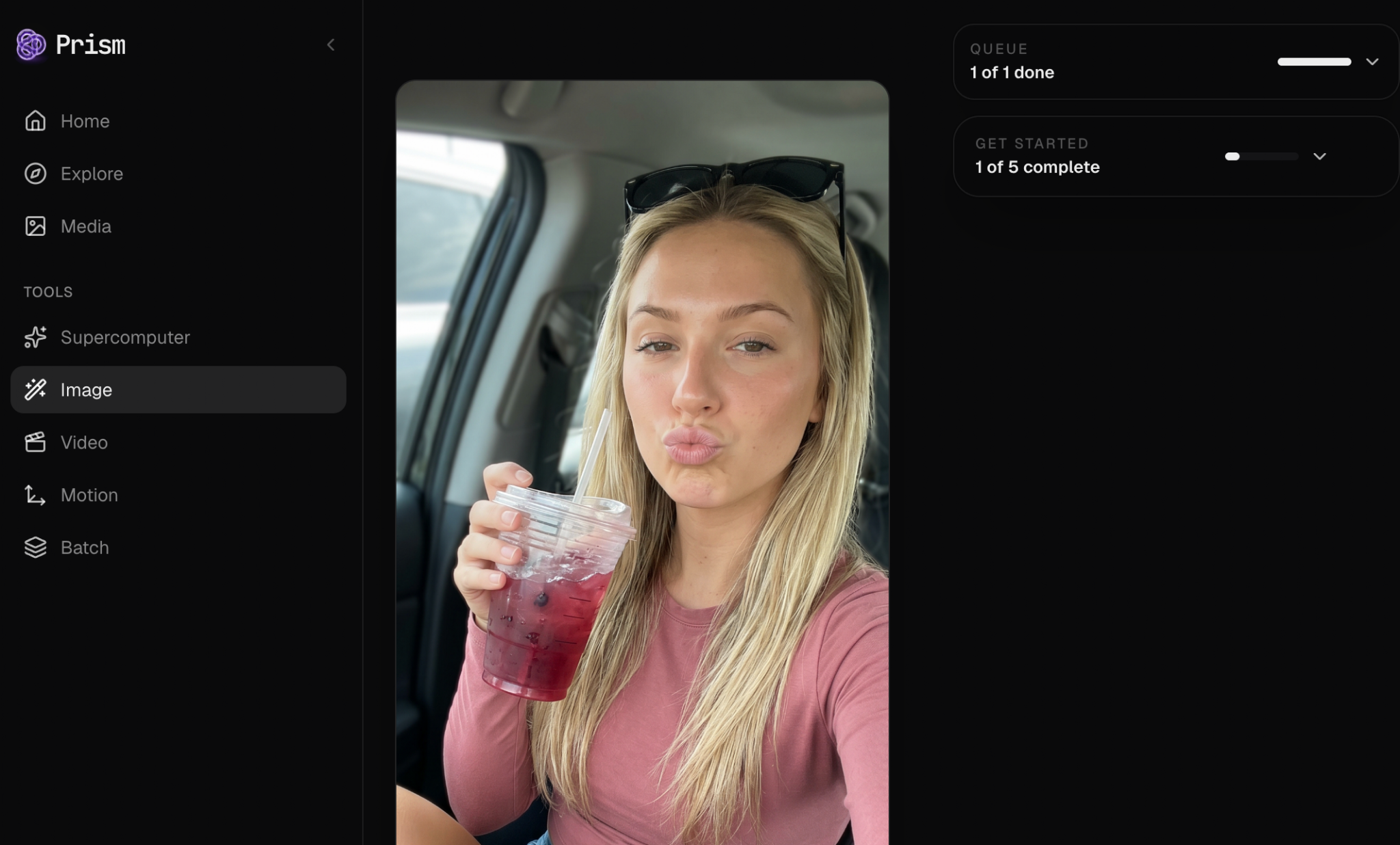 Screenshot of a woman holding a drink in Prism’s image tools.