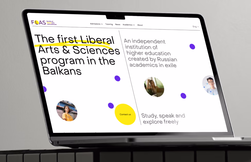 Laptop screen shows a Liberal Arts & Sciences program in the Balkans by Russian academics in exile.