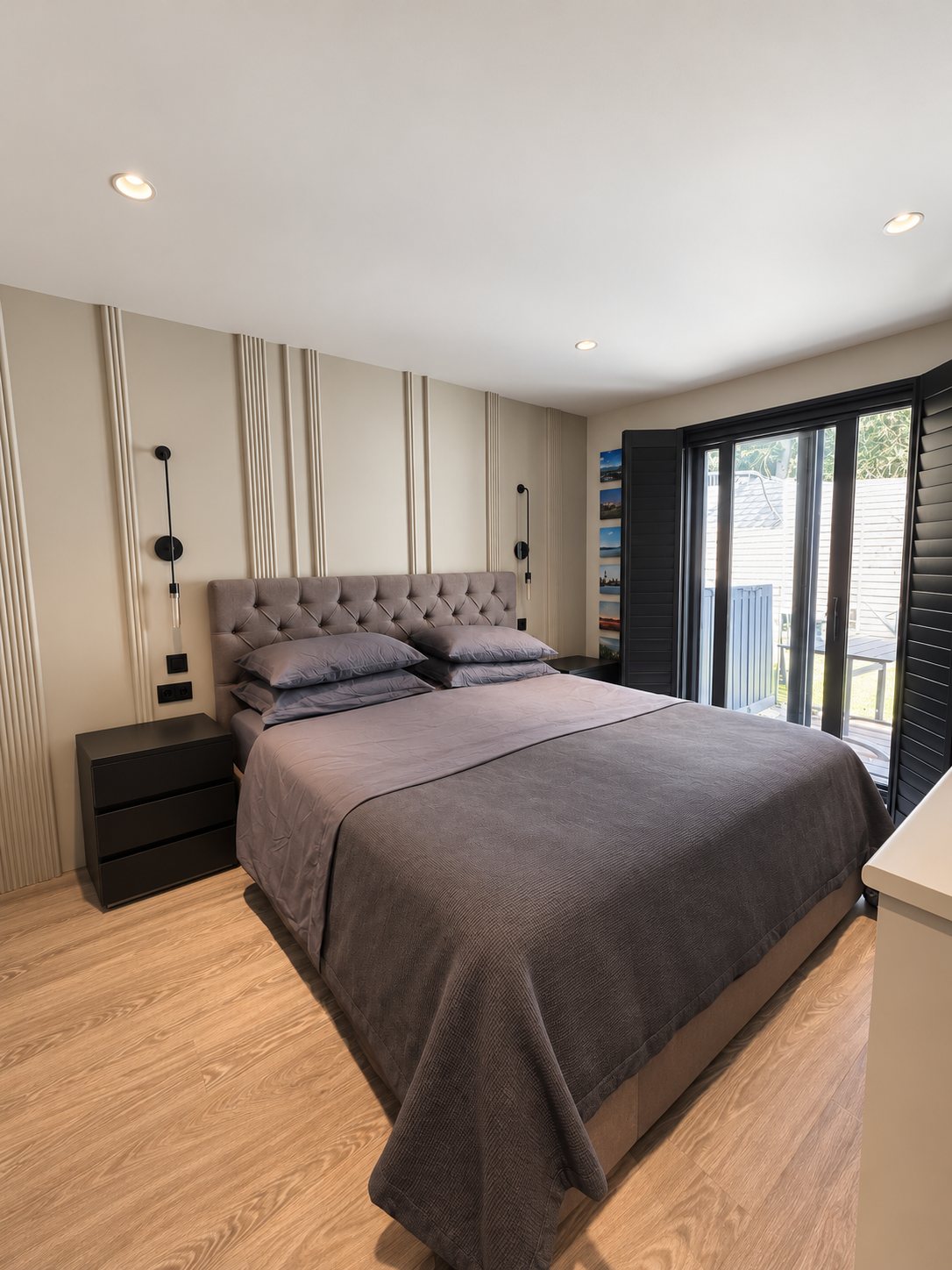 Bedroom with panelled wall, Wimbledon flat