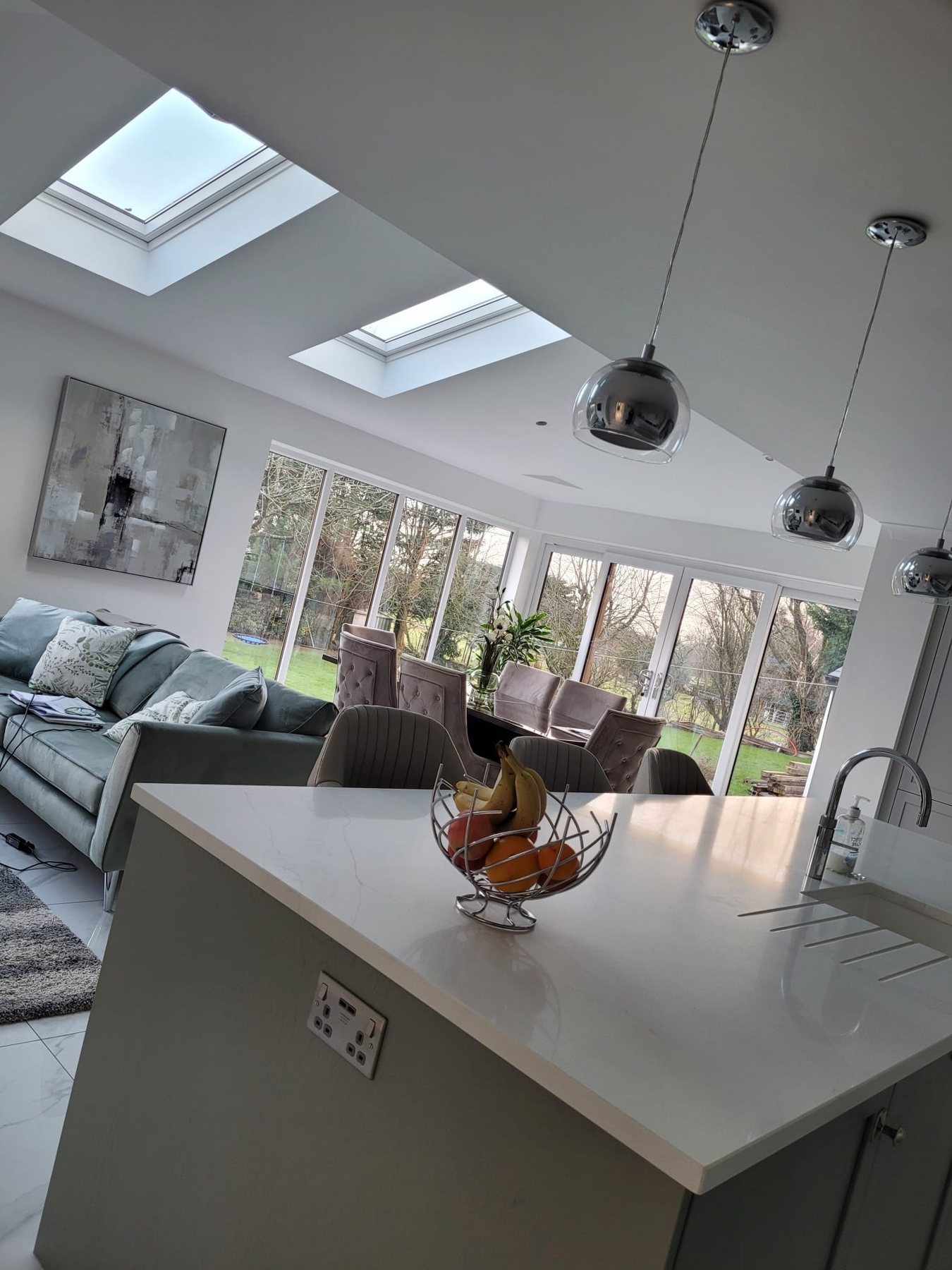 A single-storey rear extension on a detached house in Harrow, giving the family an open-plan kitchen, dining and living space with a rooflight and glazed doors onto the garden.