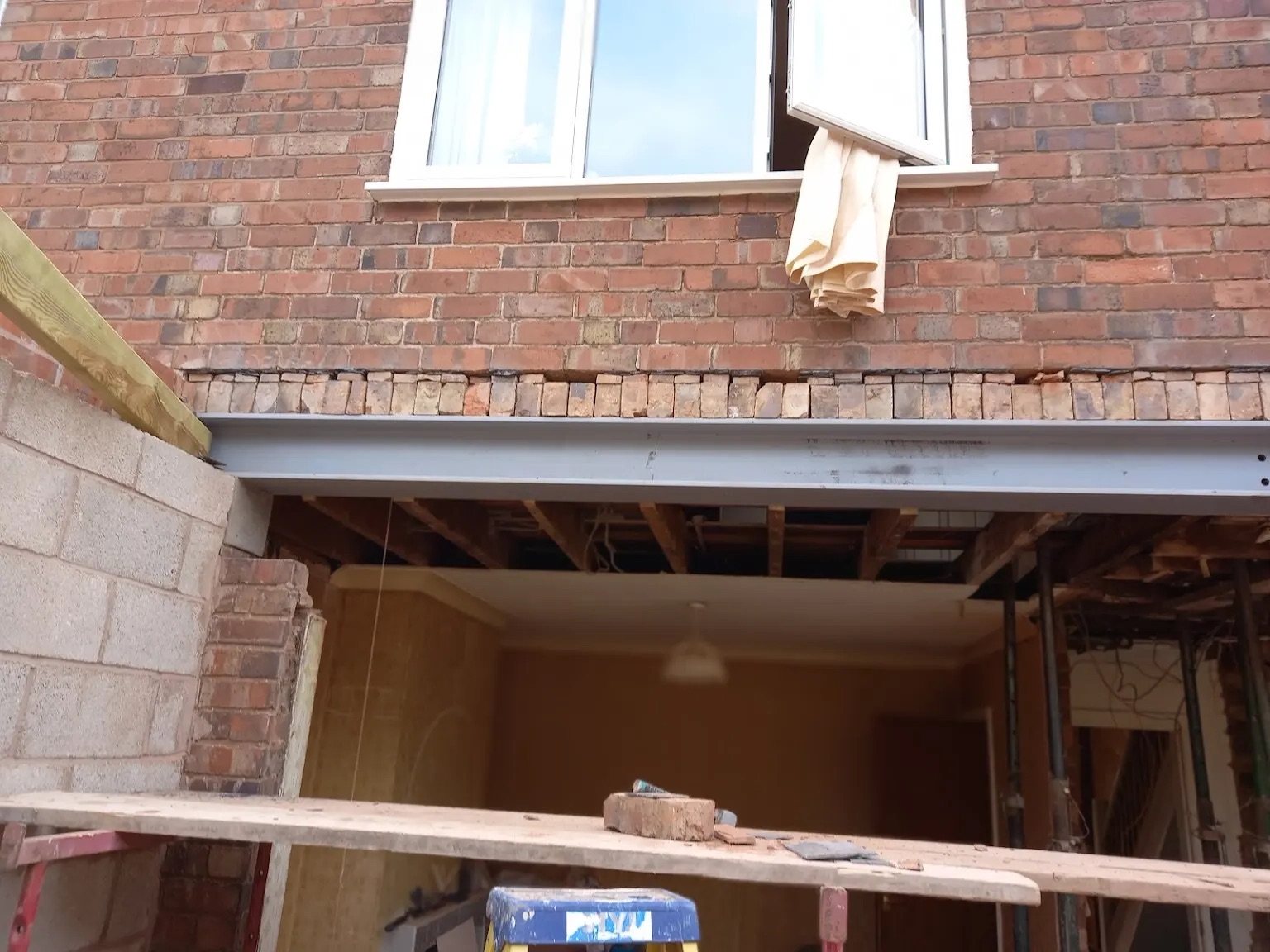 Steel beam over the full-width opening