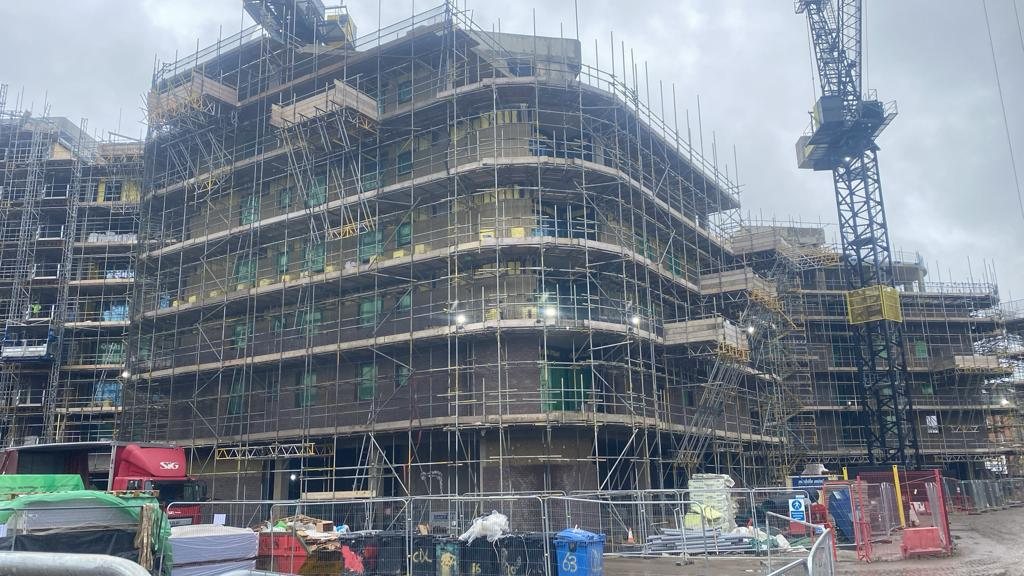 Reinforced-concrete frame for a new residential block in Oxford: suspended slabs with heavy reinforcement, columns and cores cast in situ, floor by floor.