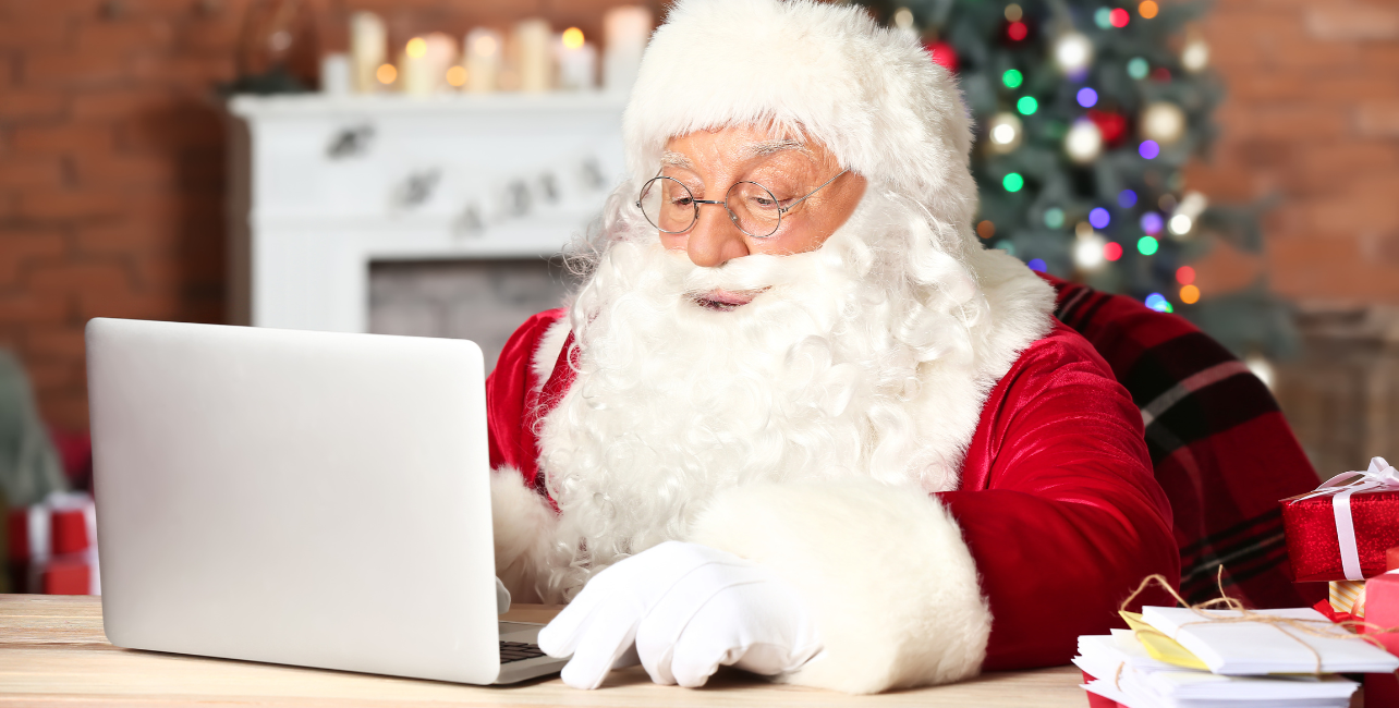 Santa checking security on laptop.