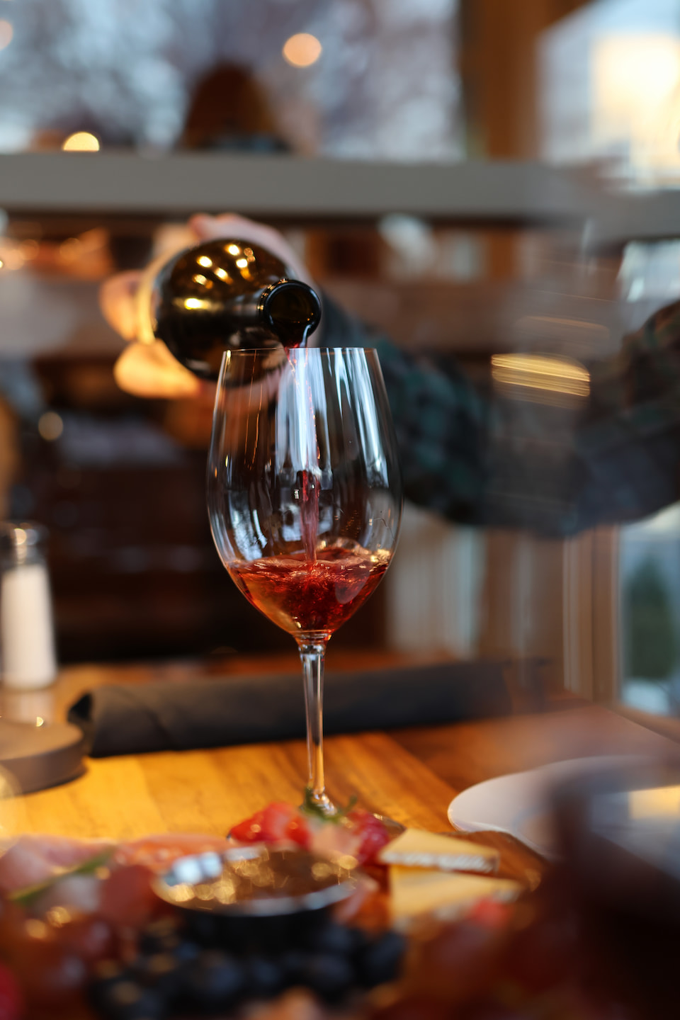 A sommelier pours a glass of red wine at Murphy's.
