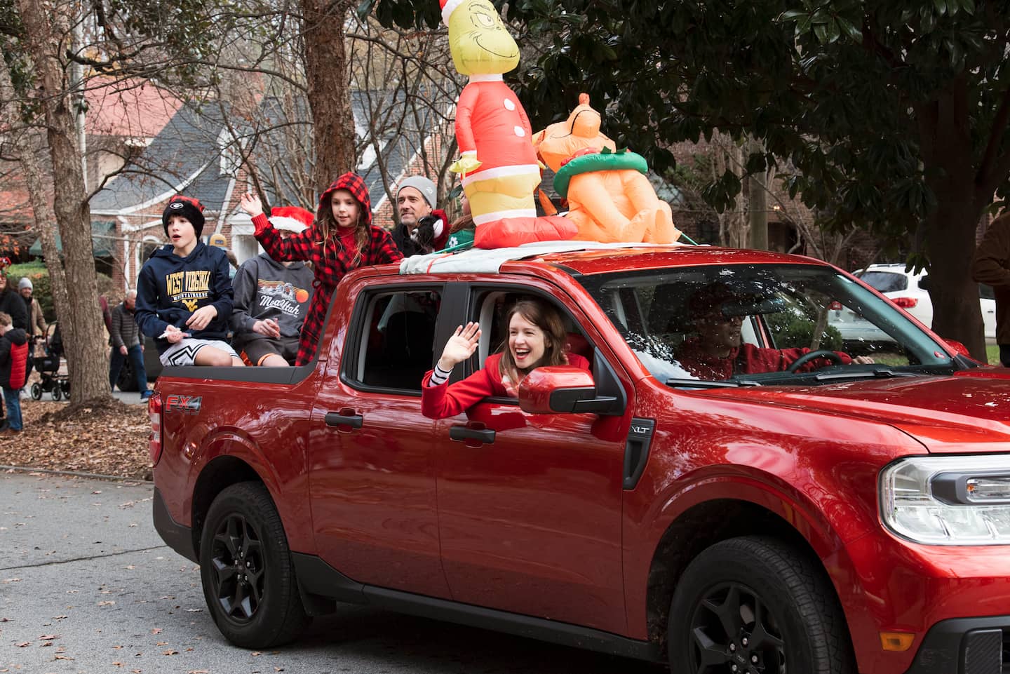 Holiday Parade floats make their way down Lanier Blvd waving at their neighbors.