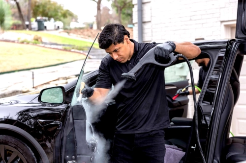 a man doing car detailing