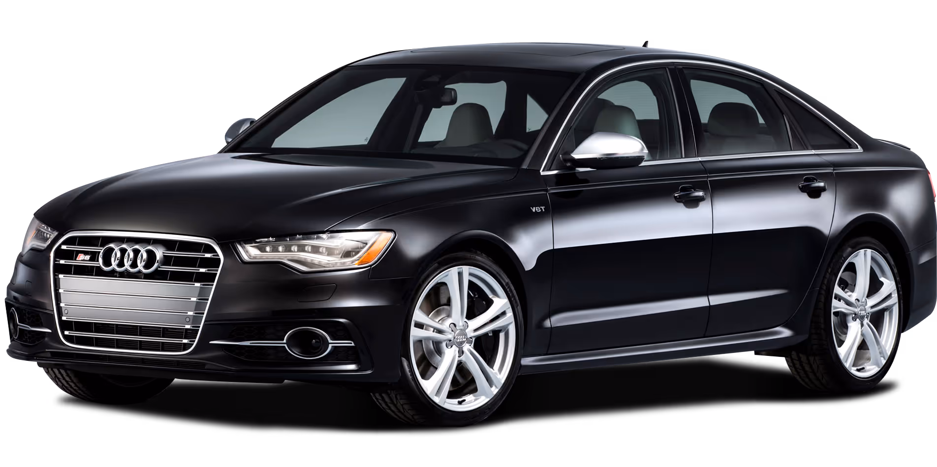Black Audi S6 sedan with silver alloy wheels and V8T badge on front fender.