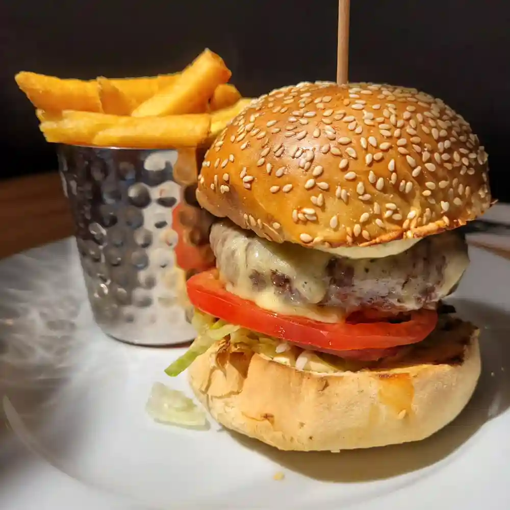 A very photogenic burger!!!
Well done Chef Adam!

Aged Angus beef, Quicks cheddar, sesame bun...and some salad.