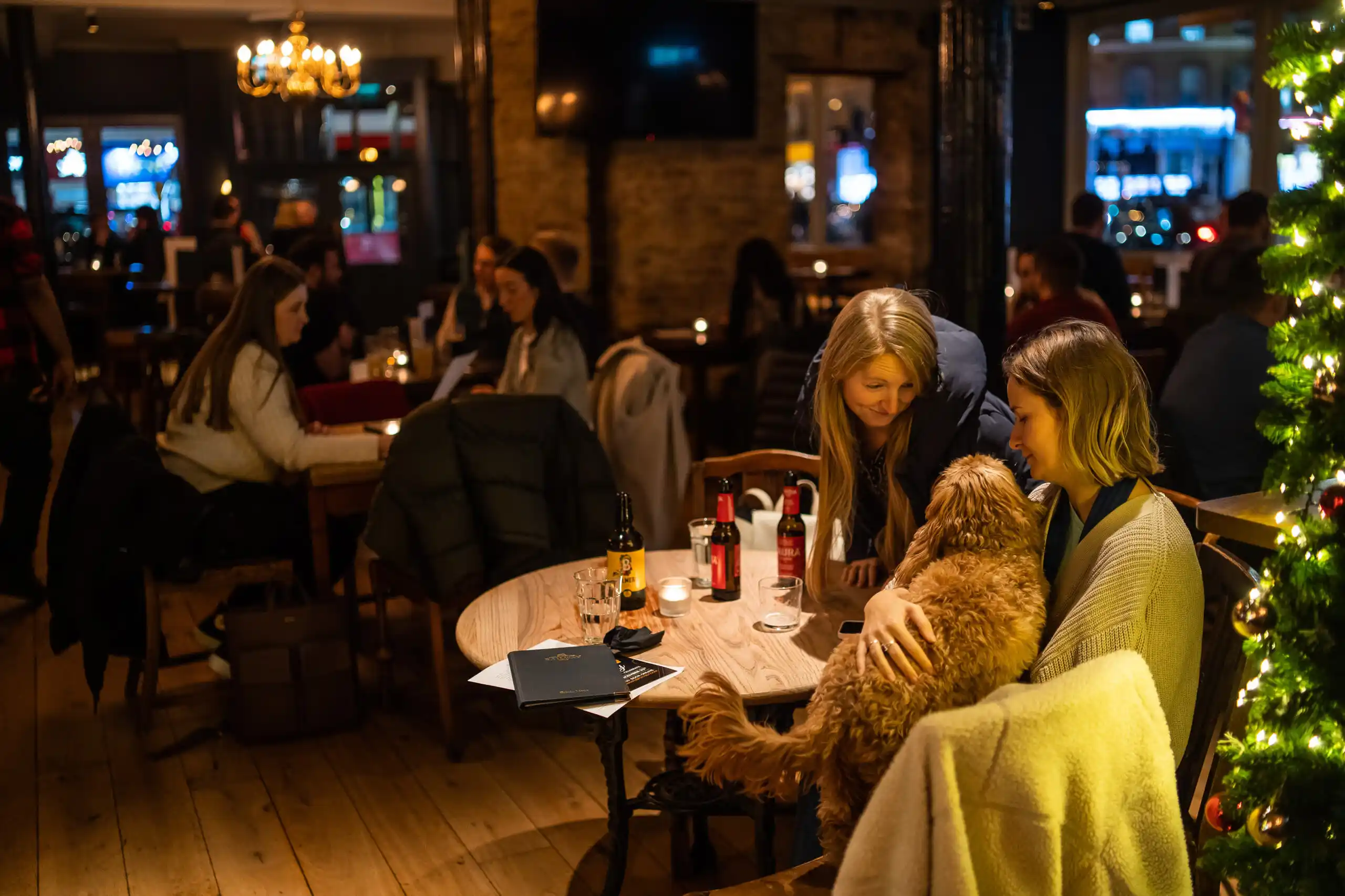 Victorian pub with a green-tiled facade, stained-glass windows and a large menu of bottled beers.