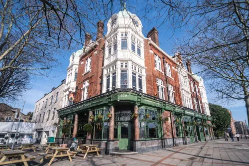 The George and Dragon has proudly returned to its original name, serving the local community of Wanstead with a refined food and drink experience. Our pub menu features expertly crafted British dishes, alongside excellent wines, real ales, and exciting cocktails. Join us for the lively atmosphere in our bar or unwind in our comfortable lounge, where you can also enjoy your new favourite roast in Wanstead. Don’t miss out on live broadcasts of big matches, events and tournaments on our big screens. If you're looking to host a party or gathering, our private spaces are perfect for your needs. When the sun is shining, relax in our inviting beer garden or on the terrace. Conveniently located just a few steps from Wanstead Station and a short distance from George Green and Christchurch Green, we can't wait to welcome you!