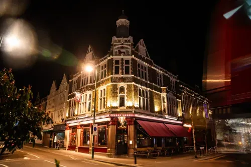 The Red Lion has been a beloved part of Leytonstone since 1870, offering a welcoming atmosphere to locals and visitors alike. We serve delicious seasonal British pub fare in our restaurant and bar, perfectly paired with a selection of great beers, fine wines, and exquisite cocktails. Whether you’re looking for a quiet corner to unwind, a seat in our newly refurbished garden, a table in our restaurant for lunch or for dinner, or a lively evening in our stunning ballroom during one of our regular events, there’s a spot for everyone. Planning an overnight stay? Our characterful boutique hotel rooms provide the perfect place to rest and recharge.