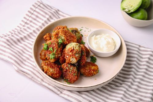 Bowl of crispy crumbed Brussels sprouts