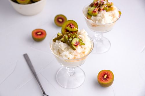 Glass of rice pudding with red kiwifruit