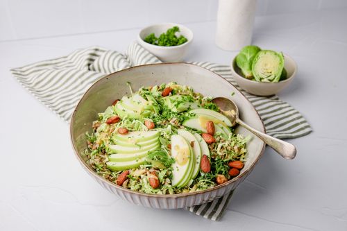 Brussels sprouts slaw in a serving bowl