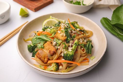 Bowl of pad thai with chopsticks