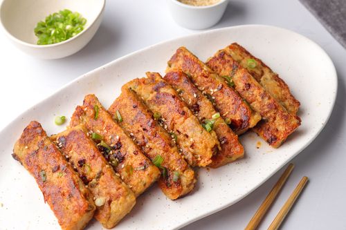 Sliced turnip cake on serving dish
