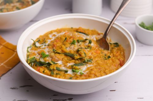 Bowl of Dhal with a spoon