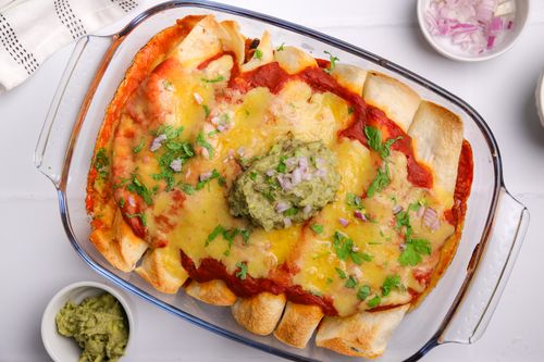 Baking tray of cheesy enchiladas