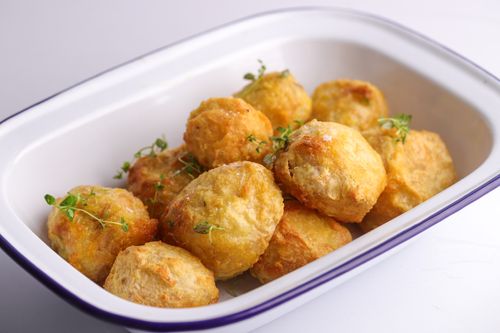Baking tray of crispy roasted potatoes