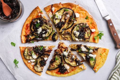 Pizza sliced on serving board