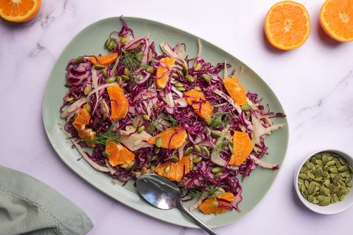 Red cabbage and fennel slaw on a serving plate