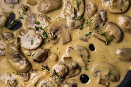 A delicious close up of creamy mushroom and garlic sauce