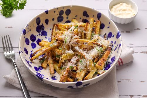 Crispy golden parsnip chips with grated parmesan, fresh parsley, and garlic mayo dip.