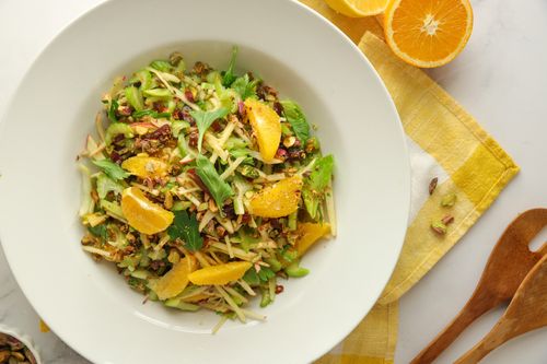 Fresh orange, celery, apple, date and pistachio salad with citrus dressing - a bright, seasonal fruit and veg recipe from Wonky Box.