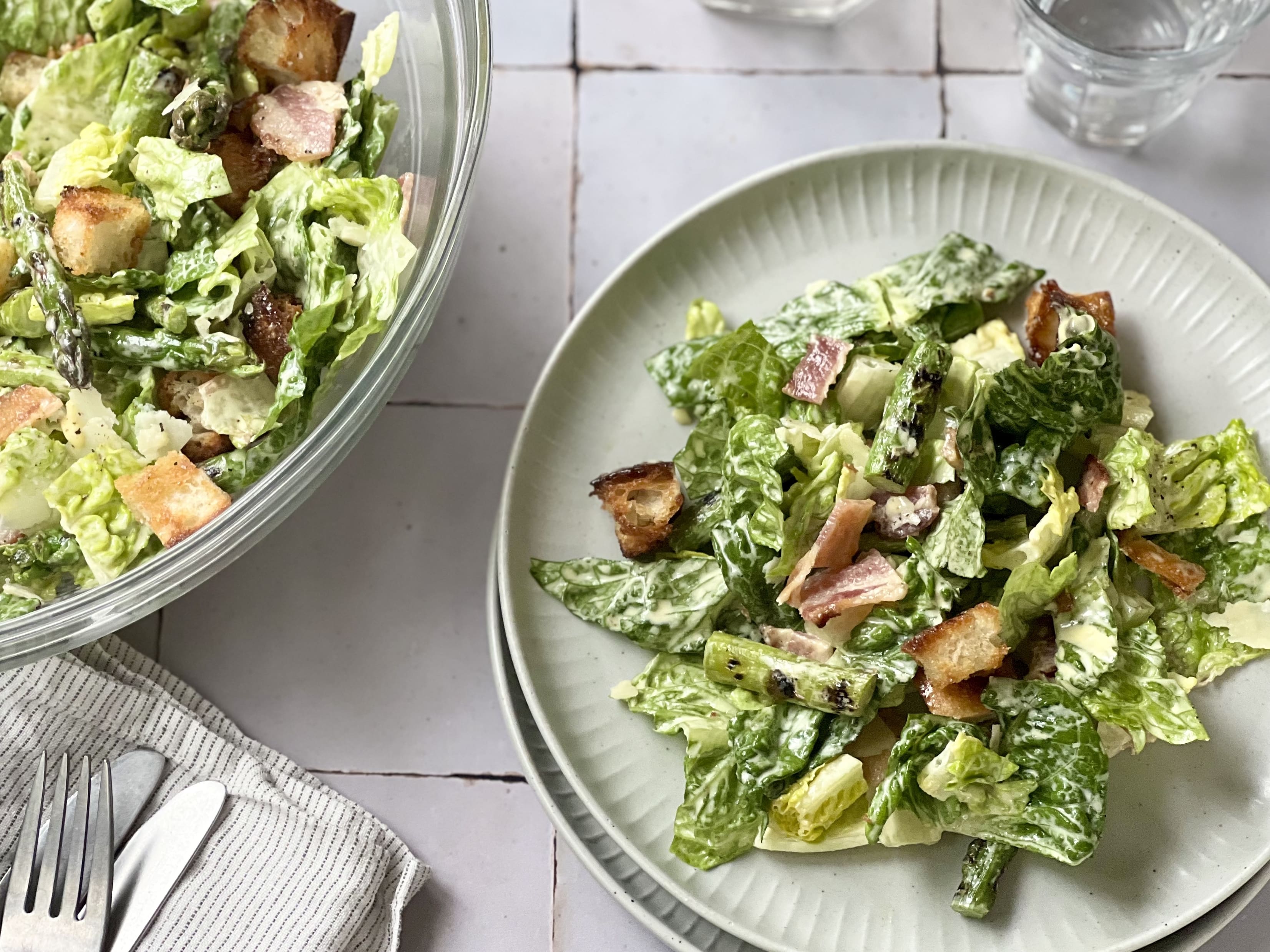 Asparagus Caesar Salad with charred spears, crispy bacon, homemade croutons, and creamy Parmesan dressing - spring in a bowl.