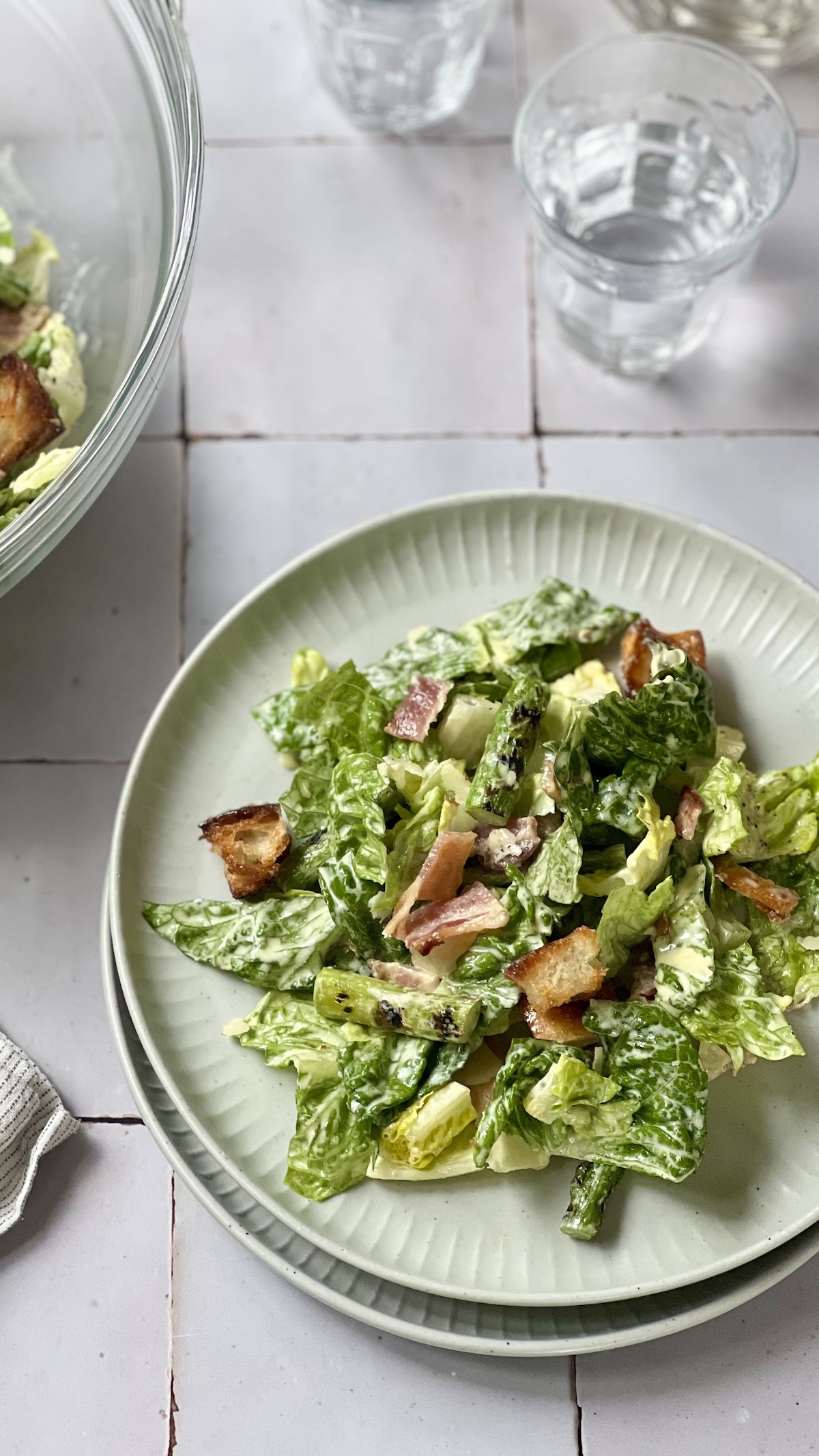 Casaer Salad in a bowl in bacon, charred asparagus and a creamy dressing