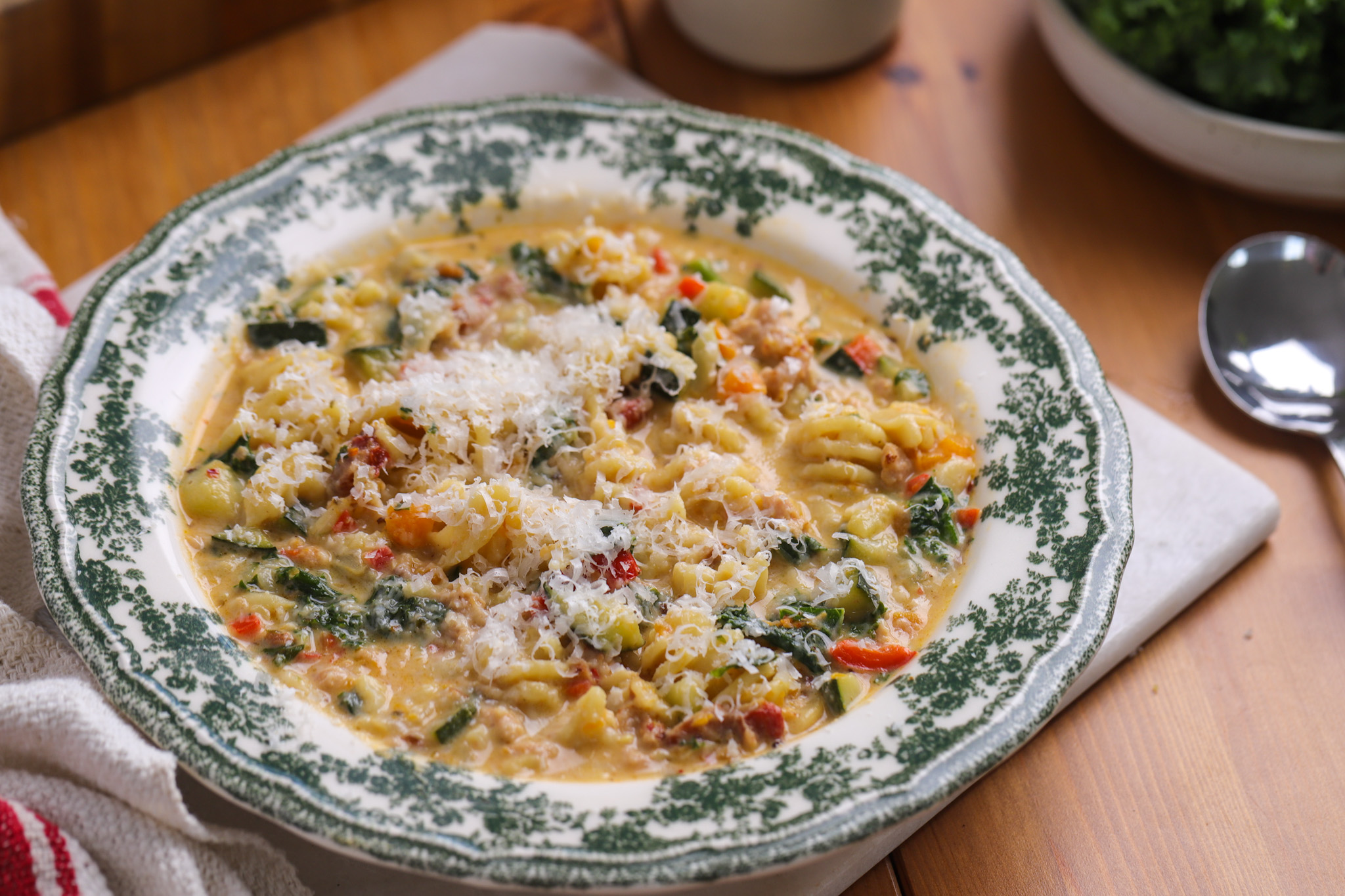 his Tuscan sausage, pumpkin and kale soup is the kind of thing you make once and immediately add to the rotation. Sausage meat crumbled straight from the casing, seasonal pumpkin, a handful of kale, and radiatori pasta — all pulled together with stock, cream, and a hit of lemon at the end. It's a proper one-pot weeknight dinner that leans hearty without being heavy, and comes together in under 40 minutes. The sort of recipe that makes a big batch feel like a smart move.