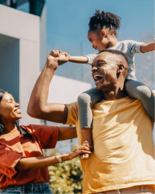 Father with young daughter on his shoulders