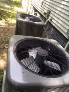 Photo of 2 AC units installed outside 2 story home with a hot upstairs