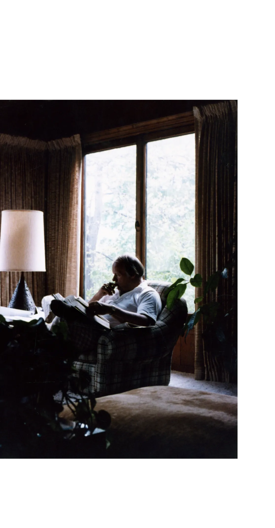 Denny Sanford thinking in a chair.