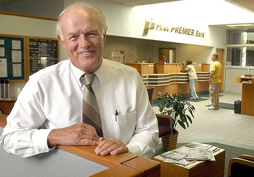 Danny Sanford smiling during contributions to First PREMIER Bank and PREMIER Bankcard.