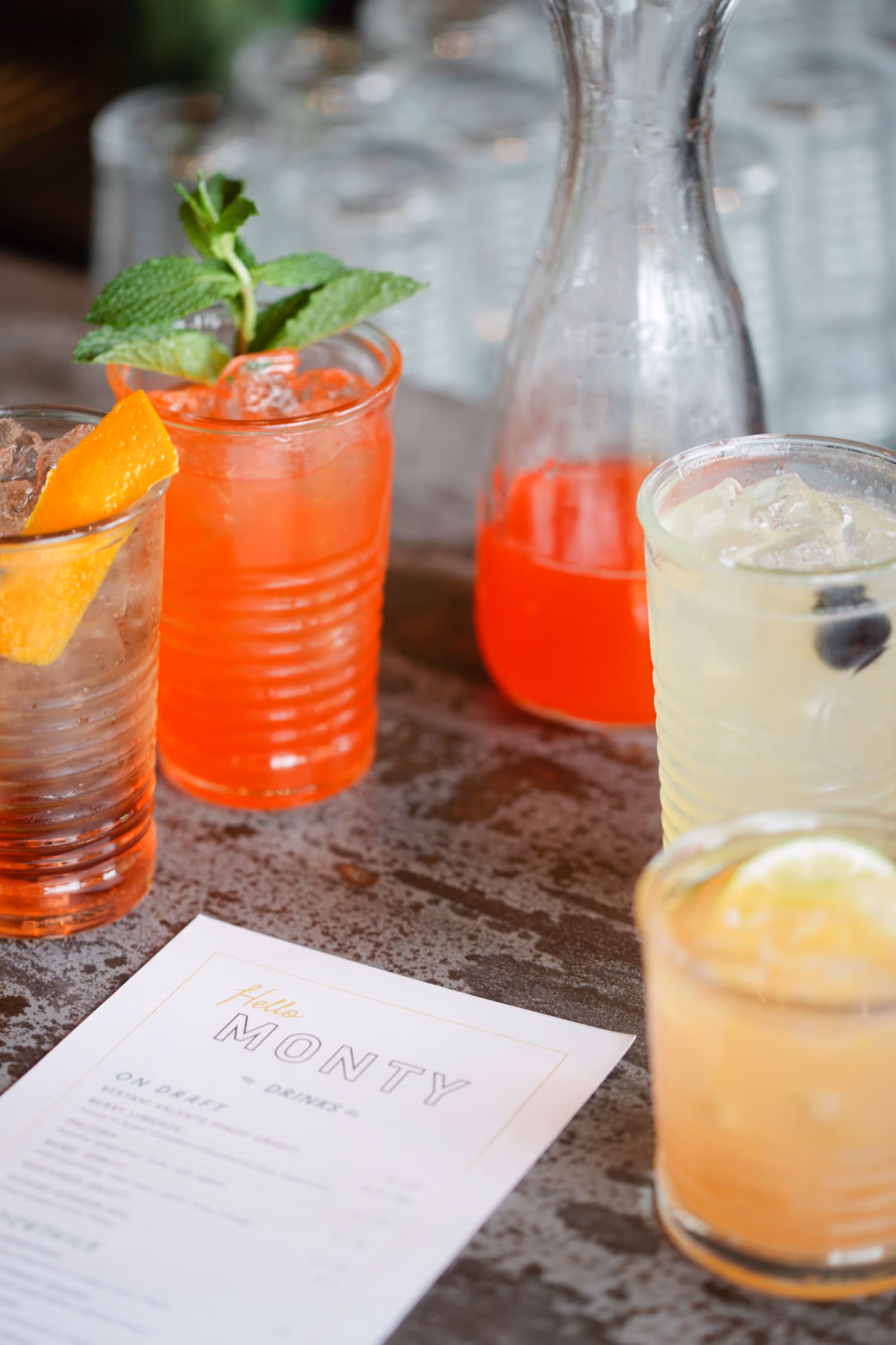 variety of colorful drinks around a menu
