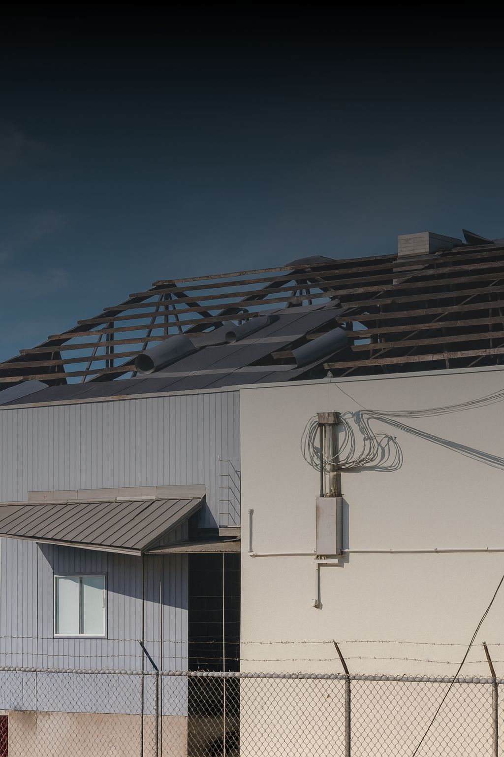 Storm damage insurance works in Sydney – repairing industrial facility after roof collapse.