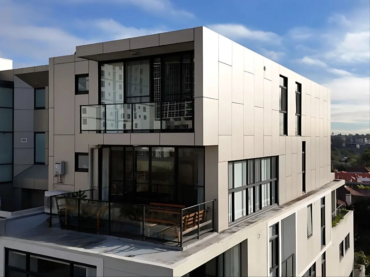 ACP cladding replacement at Chandos St, St Leonards — completed facade with new panels and balcony waterproofing