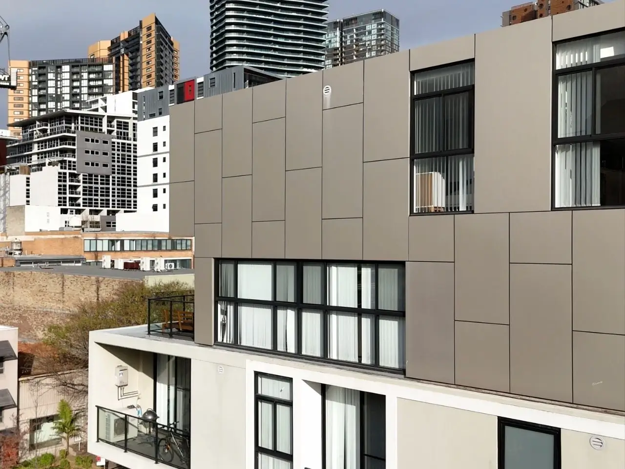 ACP cladding replacement at Chandos St, St Leonards — detail of the finished cladding panels and window junctions