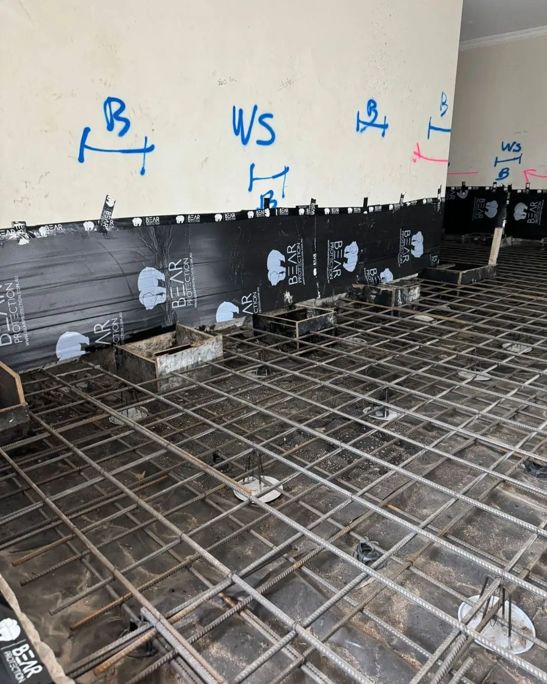 Slab replacement at Pacific Hwy, Killara — new steel reinforcement laid over waterproof membrane before the concrete pour