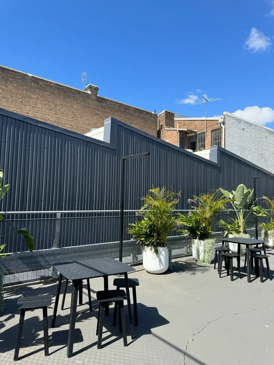 Roof works at Henrietta St, Chippendale — new perimeter metal cladding and planters on the rooftop terrace