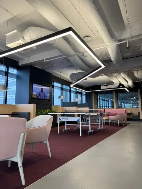 Fit out at Precinct Co-Working, Olympic Park — open-plan workspace with feature lighting and exposed services