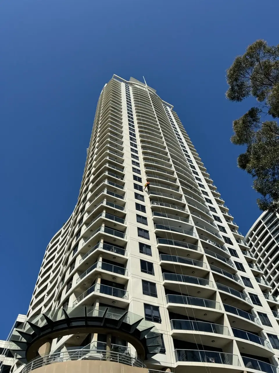 Rope access concrete repair at Sergeants Lane, St Leonards — view up the high-rise tower facade where spalling repairs were carried out