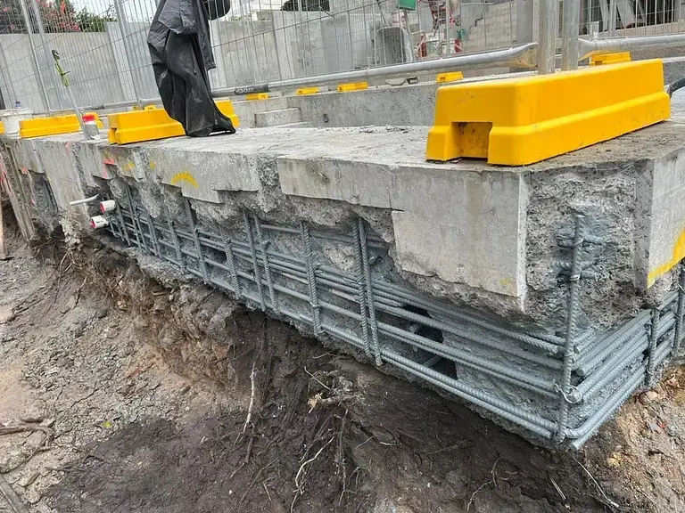 Pool remediation at Coolong Rd, Vaucluse — repaired pool edge beam with reinforcement and safety barriers in place