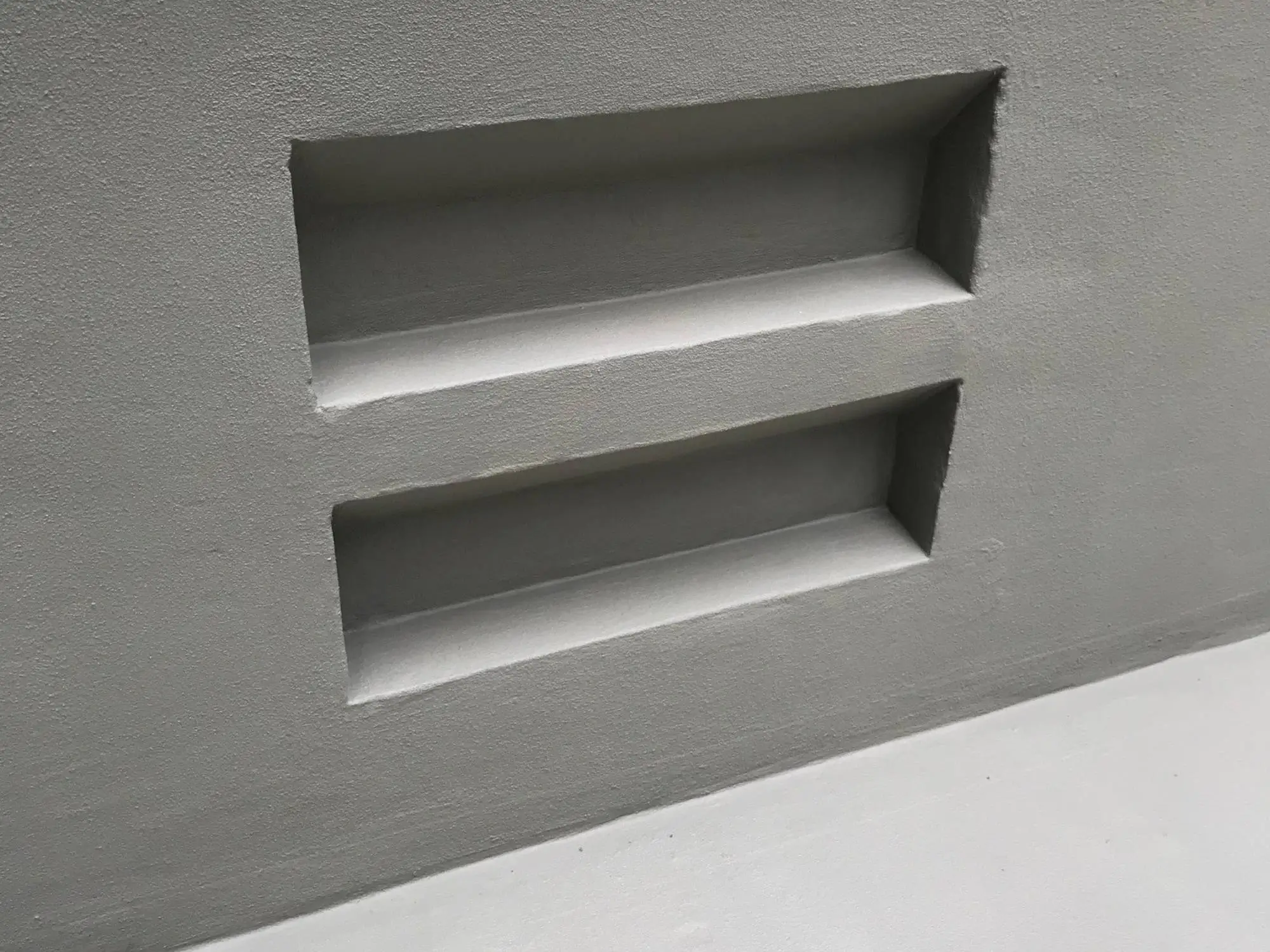 Pool remediation at Shelley St, Sydney CBD — detail of the rendered recessed niches in the pool wall